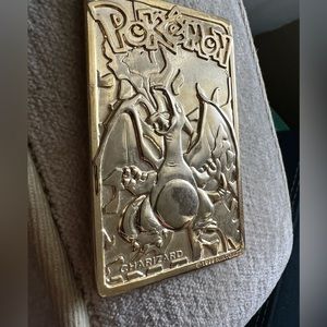 Metal charizard card with Pokémon pencil case both from the 90s